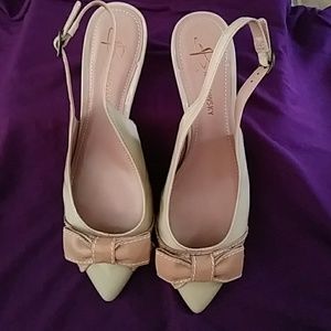 Beautiful, rarely worn slingbacks. Two tone tan.